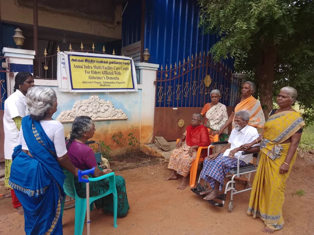 A group of residents and staff gathered outside